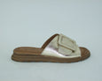 side view of Tyche Monroe leather slide with buckle in metallic gold