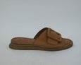 side view of Tyche Monroe leather slide with buckle in cognac