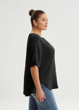 side view of Mat plus size air-wash texture polyester Split Neck Curved Hem Top in Black