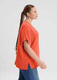 side view of Mat plus size air-wash textured polyester Short Sleeve V-Neck top in Coral