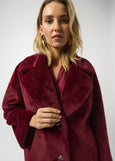 close up front view of plus size Joseph Ribkoff Faux Fur Notch lapel Coat in Merlot
