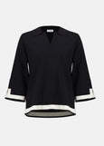 front view of plus size Joseph Ribkoff Sweater Knit color Block Top in Black/Vanilla