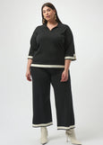 on mocel front view of plus size Joseph Ribkoff Sweater Knit Color Block Pant in Black/Vanilla