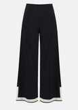 front view of plus size Joseph Ribkoff Sweater Knit Color Block Pant in Black/Vanilla