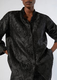 close up front view of plus size Marina Rinaldi Rupia Floral Tonal Jacquard Evening Jacket in Black