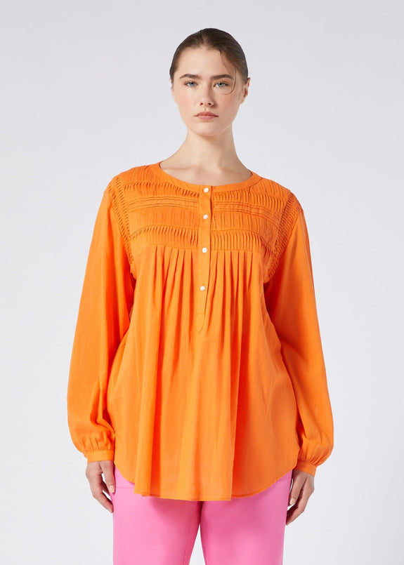 front view of Marina Rinaldi Mira Pleated Tuck Front cotton Peasant Blouse with Liner on model in Orange