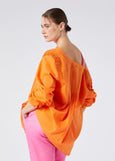 back/side view of Marina Rinaldi Mira Pleated Tuck Front cotton Peasant Blouse with Liner on model in Orange