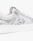 side view showing zipper and glitter details of Nero Giardini Skipper Bianco Zip Closure Platform Runner in White