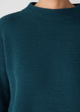 close up front view of plus size Eileen Fisher Peruvian Cot. Blend Funnel Neck Bracelet Slv. Sweater in Alpine