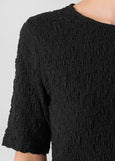 close up front view of plus size Eileen Fisher Bubble Texture Crew Neck Snug Top in Black