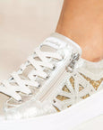 close up view of Nero Giardini Paradise Zip Closure with Lace Platform Runner in Champagne