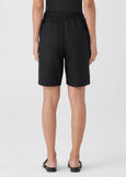 back view of Eileen Fisher Organic Linen zip front Elastic Waist plus size Shorts in Black