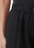 close up front view of Eileen Fisher Organic Linen zip front Elastic Waist plus size Shorts in Black