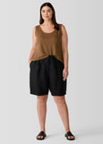 front view of Eileen Fisher Organic Linen zip front Elastic Waist Shorts on plus size model in Black