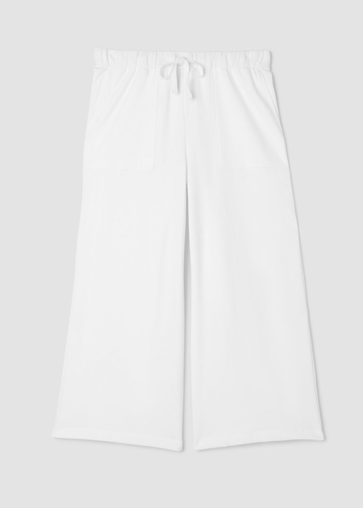 Eileen Fisher white pants on a light gray background