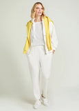 front view of plus size Luisa Viola Zip Front Hoodie in Milk styled with pant on model