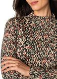 close up front view of plus size Liverpool Long Sleeve Pleated Mock Neck Knit Top in Multi Geo Ikat