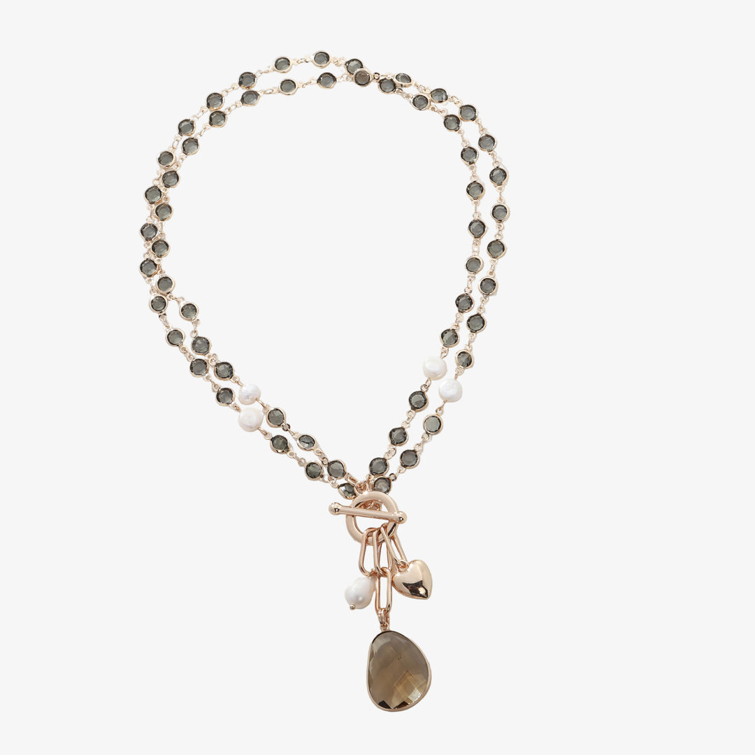 Gold-tone stone bead necklace with faux pearls and hanging brown teardrop charm