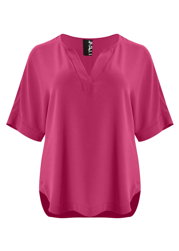 front view of Mat plus size txtured polyester air-wash Split Neck Curved Hem Top in Fuchsia