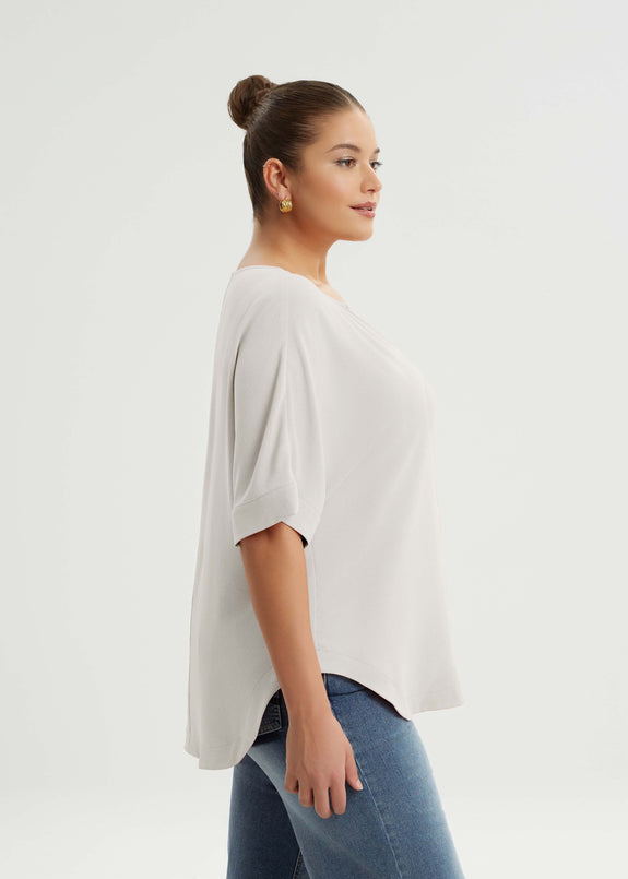 side view of Mat air-wash polyester Split Neck Curved Hem plus size top in White