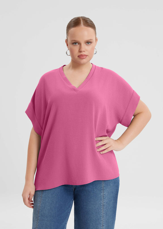 front view of Mat plus size air-wash textured polyester Short Sleeve V-Neck top in Bright Pink