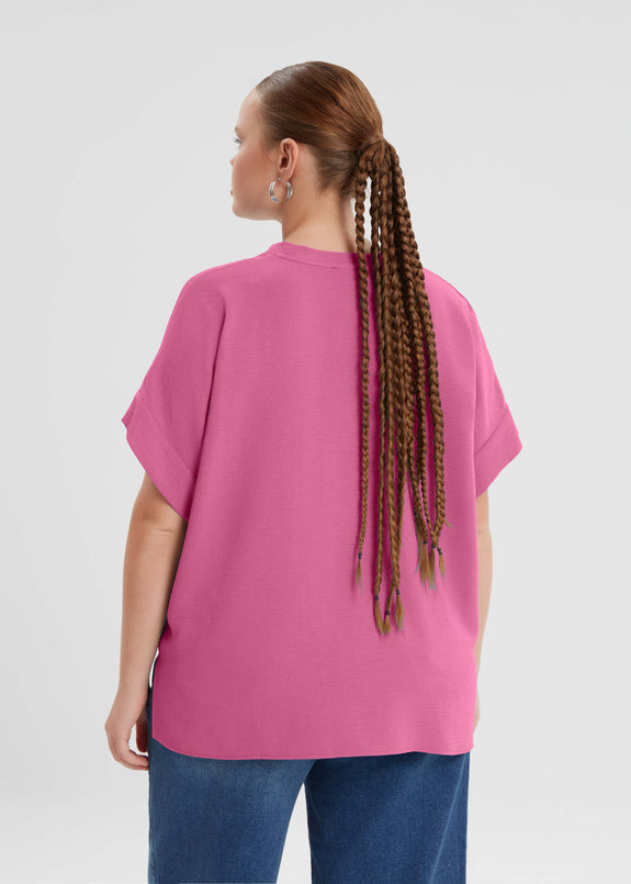 back view of Mat plus size air-wash textured polyester Short Sleeve V-Neck top in Bright Pink