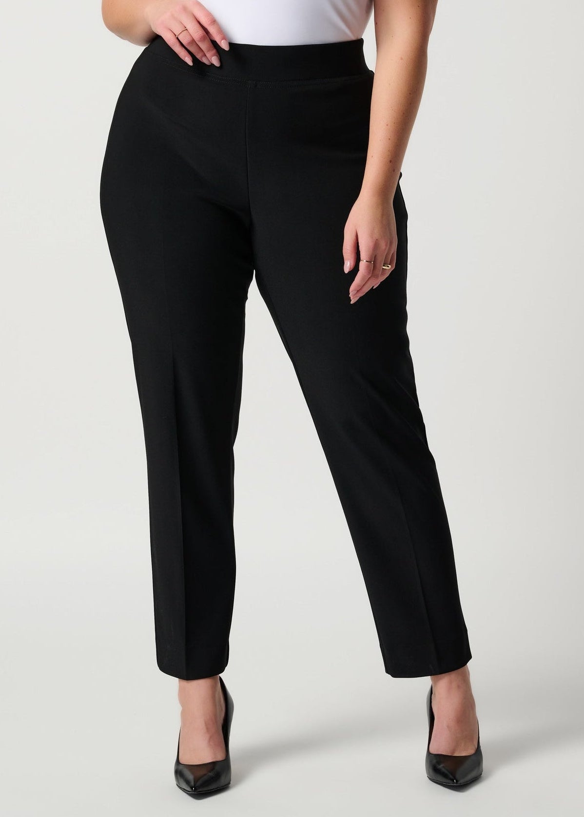 Black slim fit pants with ankle-length tapered legs, side pockets