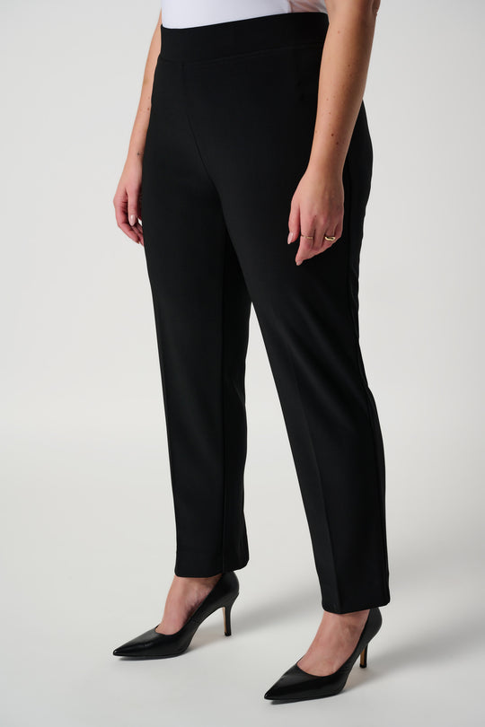 Black slim fit trousers with high waist and tapered ankle-length legs