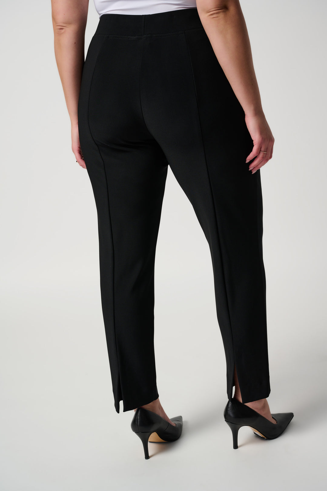 Black slim fit pants with back seam and tapered ankle-length legs