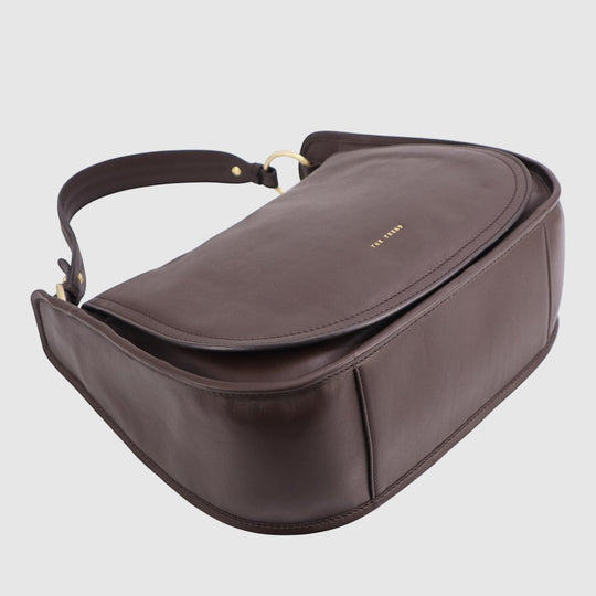 Dark brown hobo bag with top zip closure, curved flap, and gold-tone hardware.