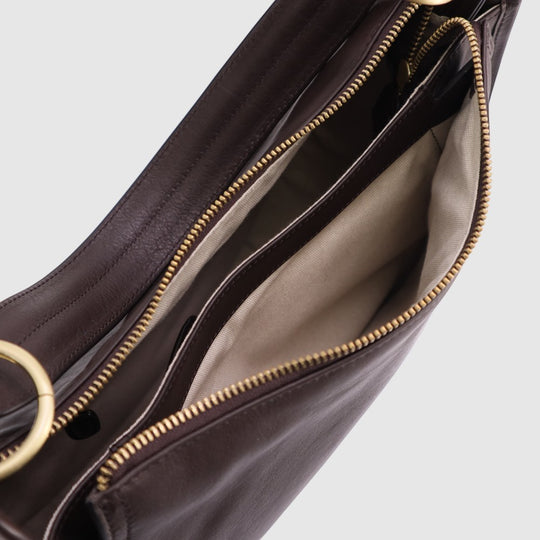 Dark brown leather hobo bag with gold zipper and fabric-lined interior compartments.