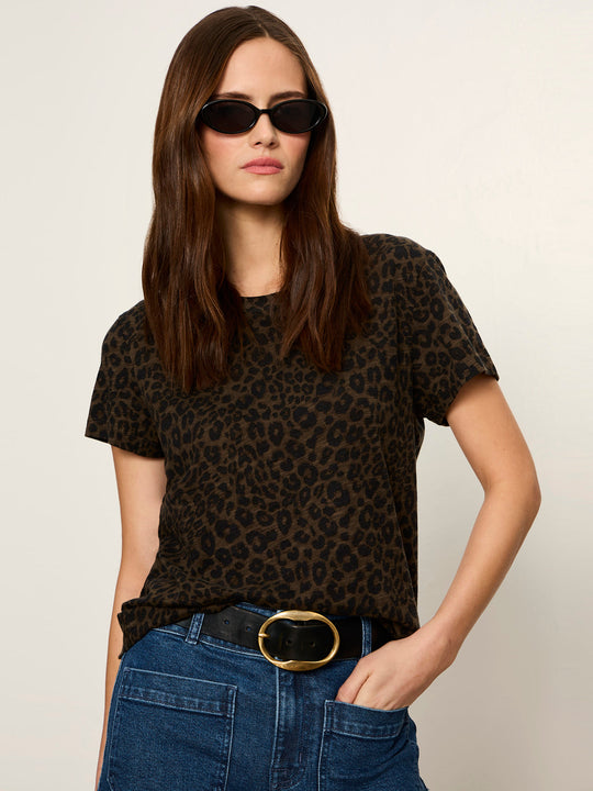 Short sleeve crew neck tee in dark brown leopard print, worn by model with jeans and belt