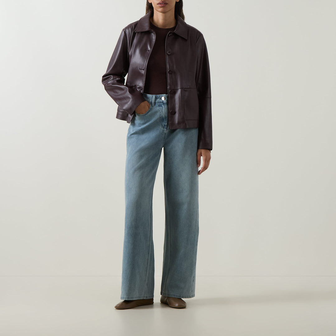 Faux leather button-front jacket in must, stand collar, full sleeves, button placket.