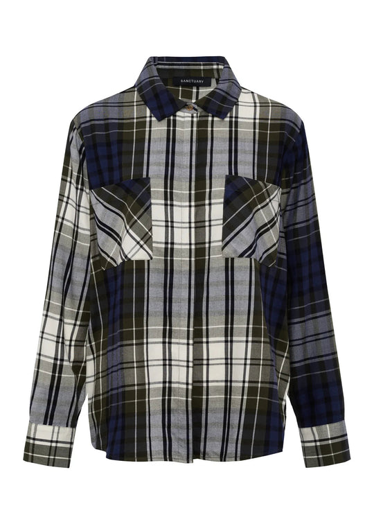 A long-sleeve plaid button-up shirt with a unique patchwork design, featuring dark blue, gray, white, and black tartan patterns across different panels, shown on a plain white background.