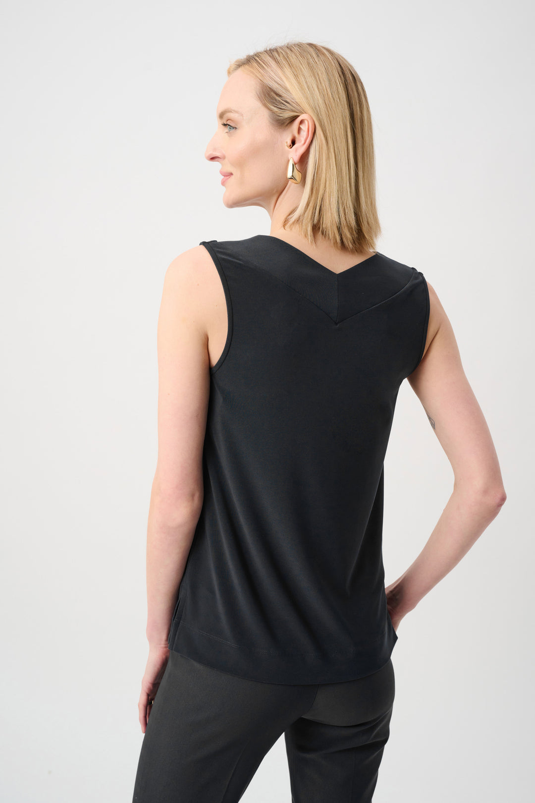 Joseph Ribkoff black sleeveless knit top with V-back and curved hem