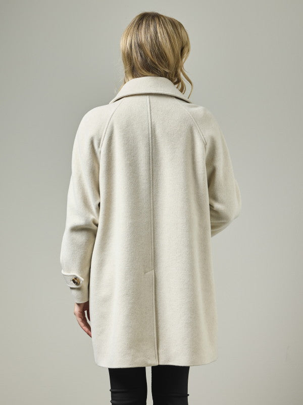 Wool blend A-line coat with raglan shoulders shown from back on model, light oatmeal color