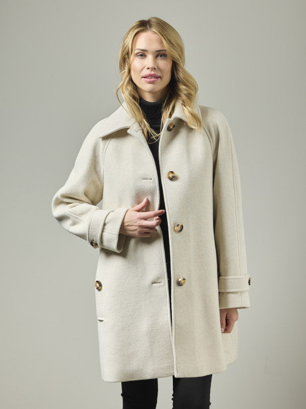 Women's wool blend A-line coat in cream with gold buttons and raglan sleeves, front view