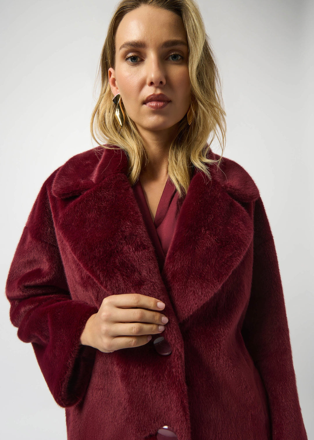close up front view of plus size Joseph Ribkoff Faux Fur Notch lapel Coat in Merlot