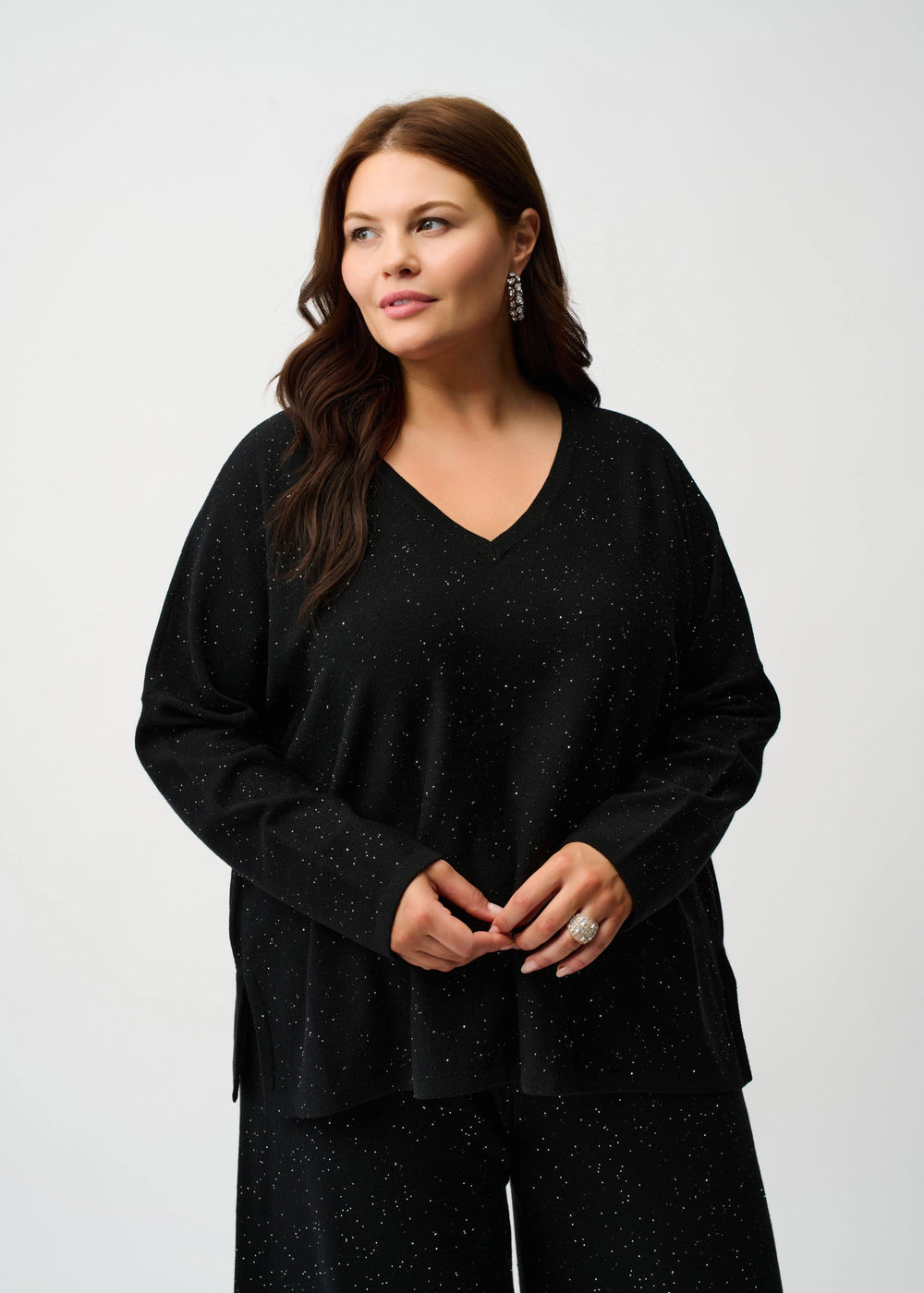 front view of plus size Joseph Ribkoff V-Neck Sequin Knit Boxy Sweater in Black