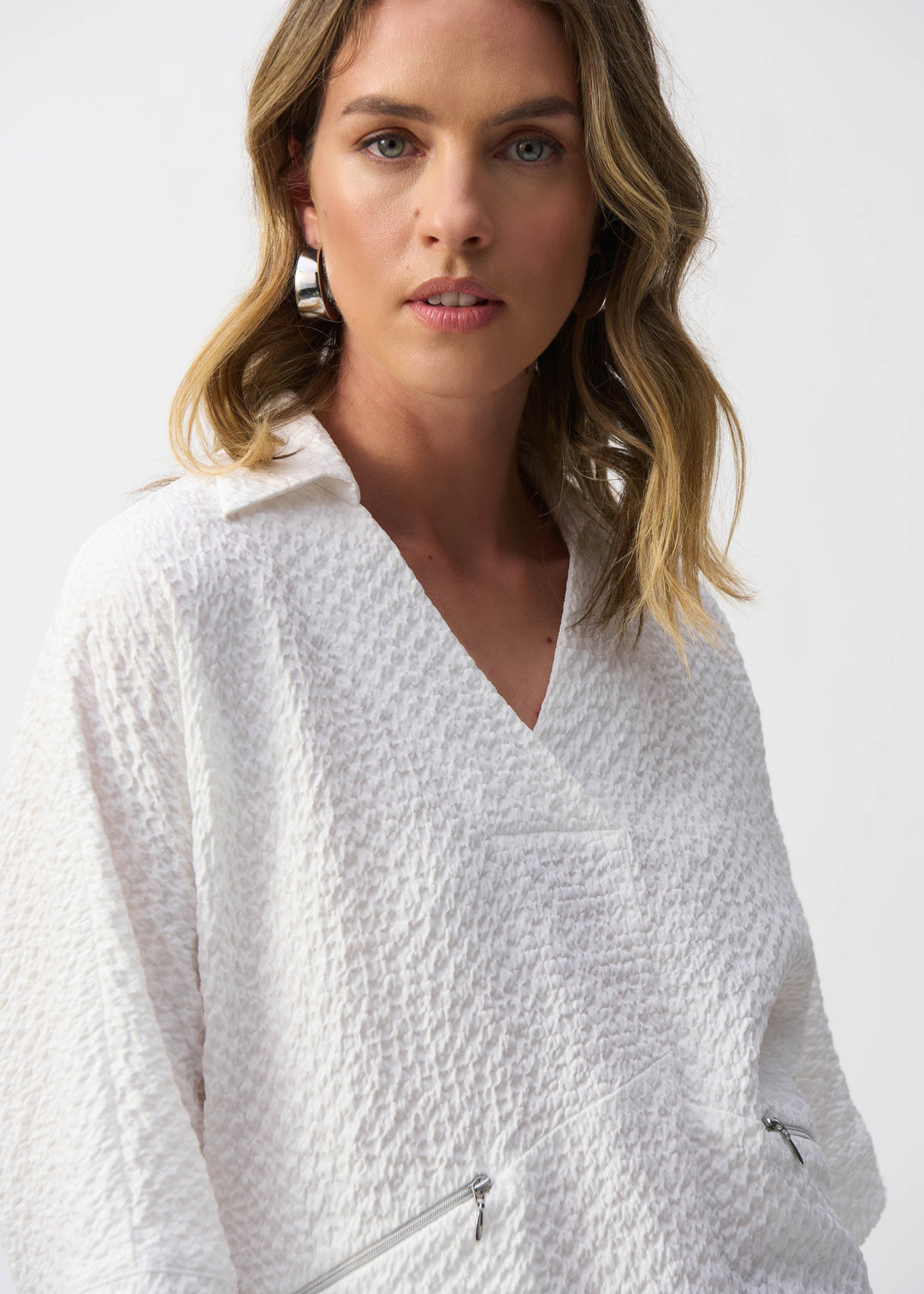 close up front view of plus size Joseph Ribkoff Seersucker Boxy Hi-Lo top in White