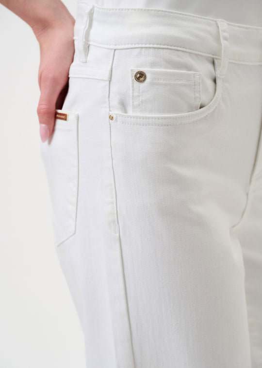 White jeans close-up: stitched front pocket, gold button, belt-loop waistband
