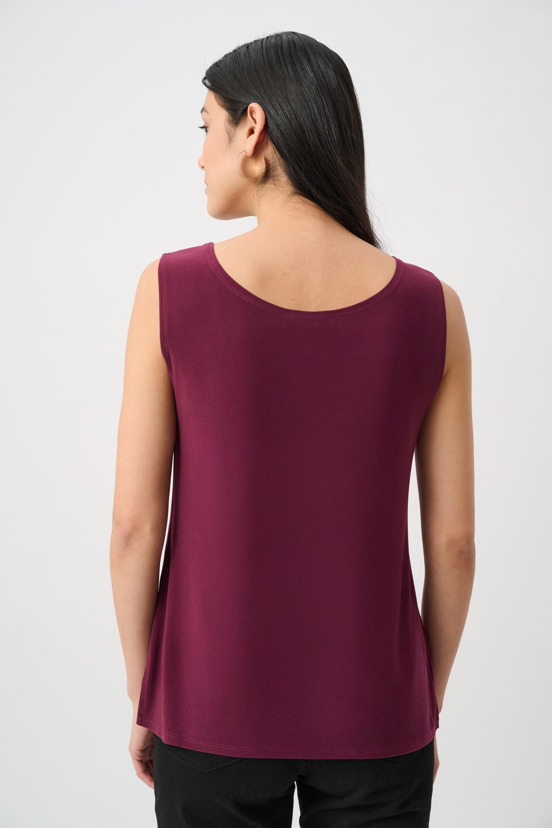 Wine-purple silky knit scoop-neck cami, sleeveless, back view with straight hem.