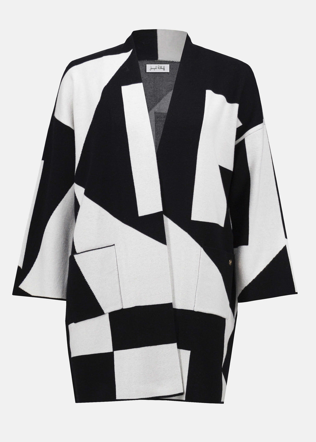 Black and white geometric patterned jacket on a white background