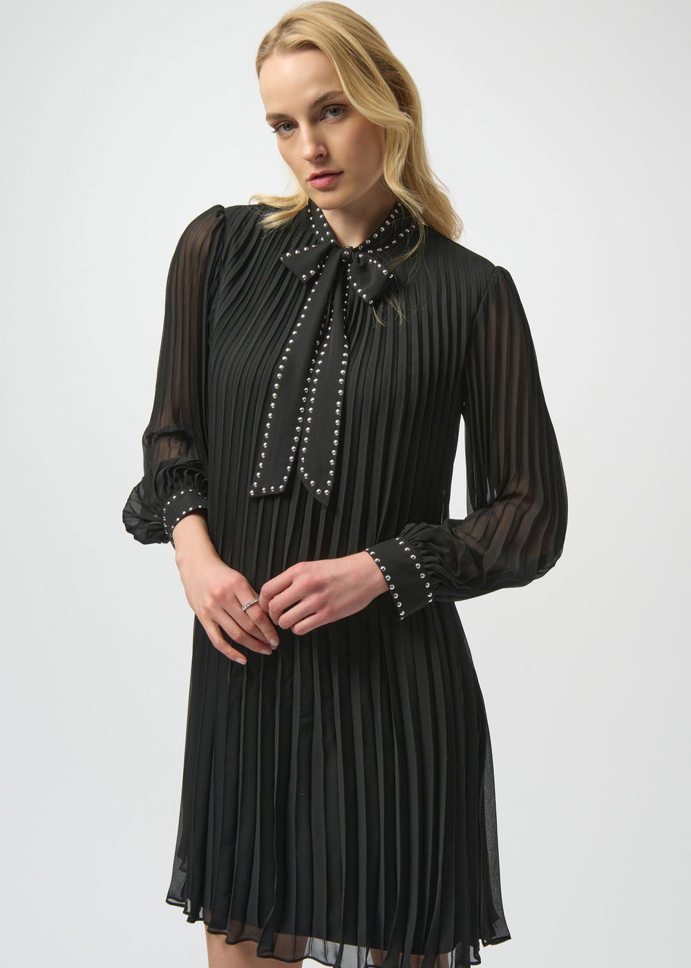 front view of plus size Joseph Ribkoff Pleated Chiffon A-line dress with Tie Neck in Black