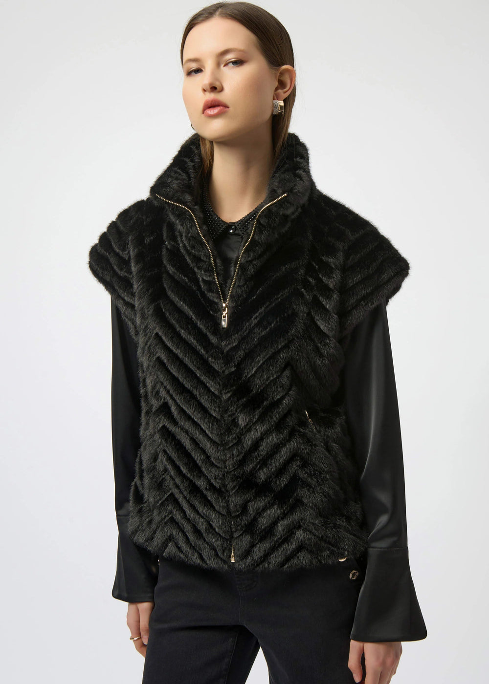 front view of plus size Joseph Ribkoff Chevron Faux Fur Mock Neck Zip Front Vest in Black