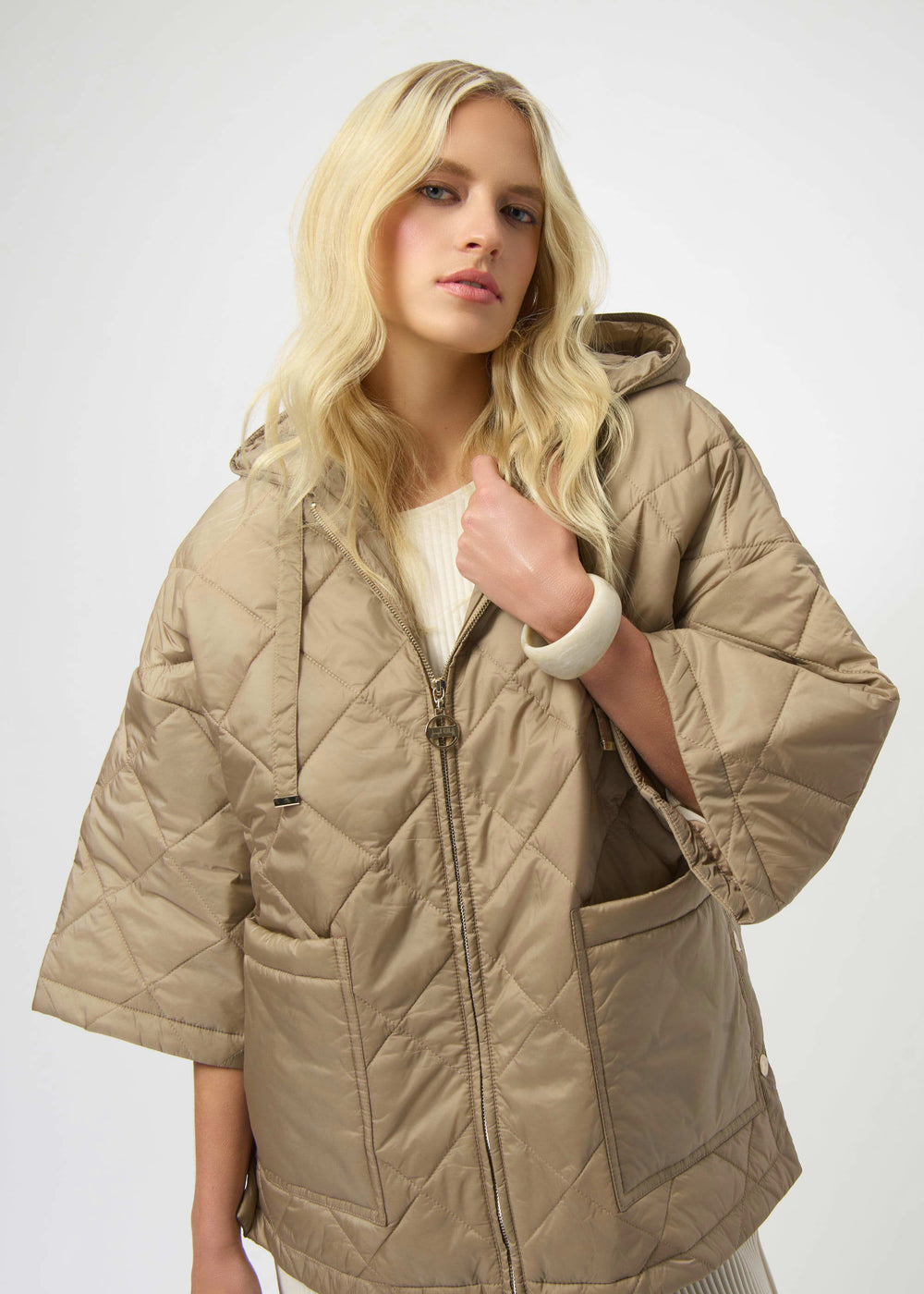 front view of plus size Joseph Ribkoff diamond quilted hooded Jacket in Gold