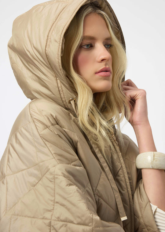 close up view of plus size Joseph Ribkoff diamond quilted hooded Jacket in Gold