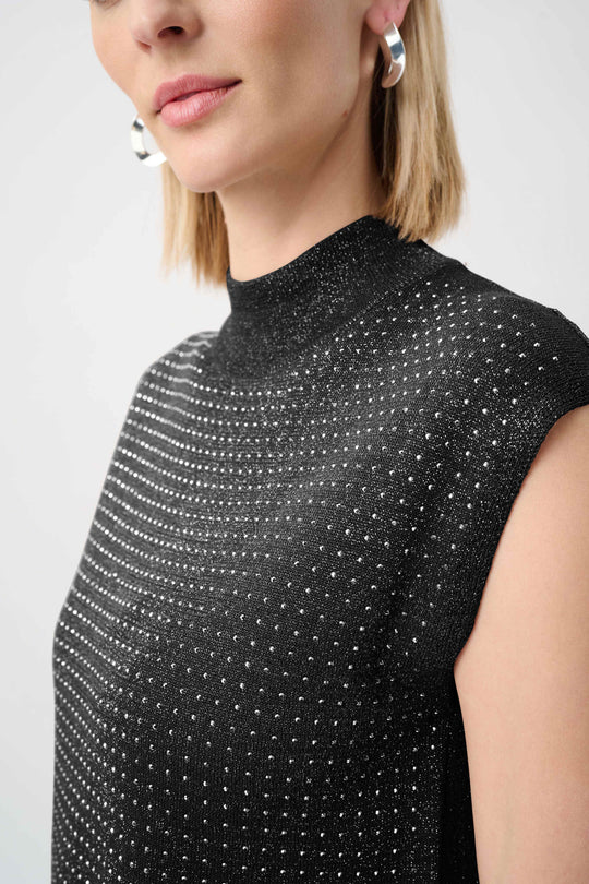 Black mock-neck sleeveless sweater close-up of dotted iron-on texture