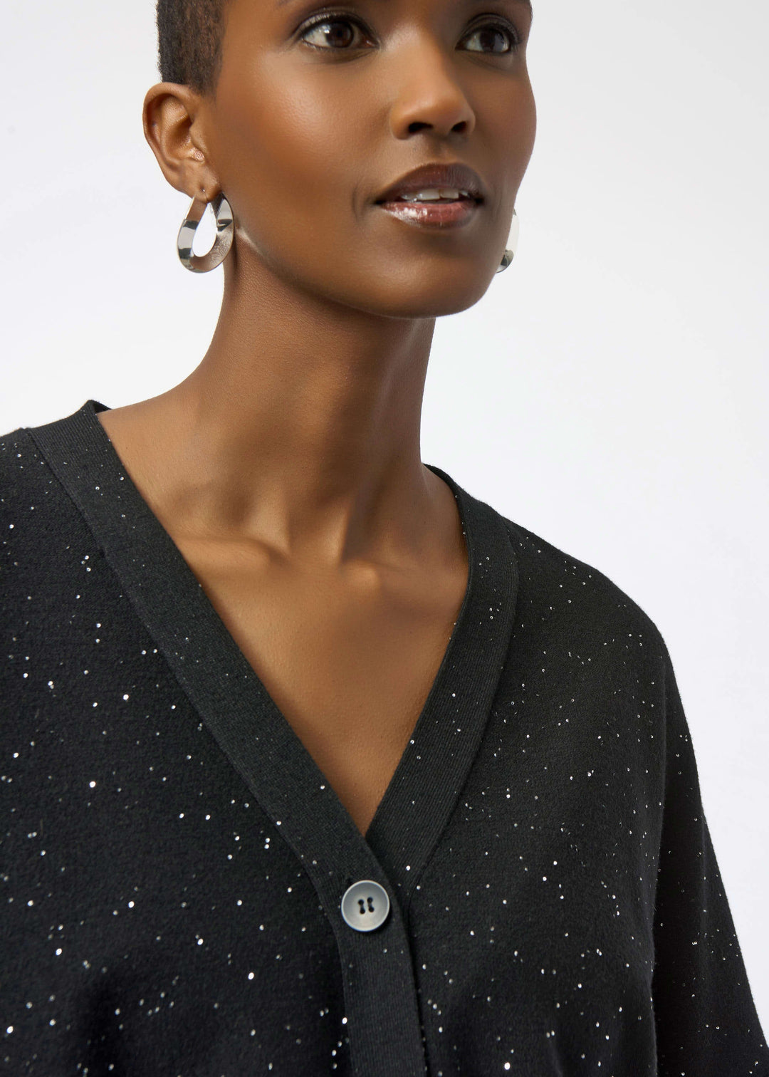close up of plus size Joseph Ribkoff Sequin Knit Button Front Cardigan in Black