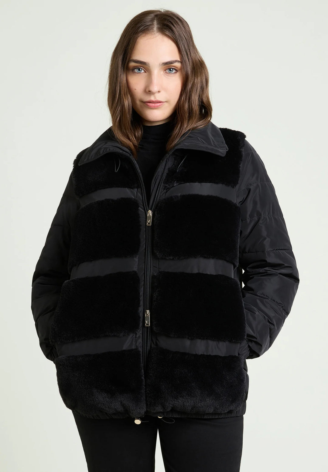 Black nylon puffer jacket with plush paneling and front zip closure